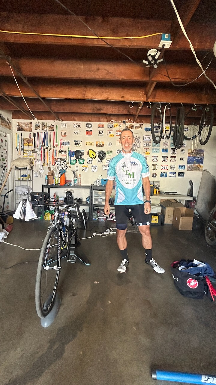 Coached athlete Miguel next to his indoor trainer setup
